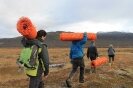 Helping to put up snow fences at the research site (Photo: Magdalena Tomasik, Arctic Portal) 